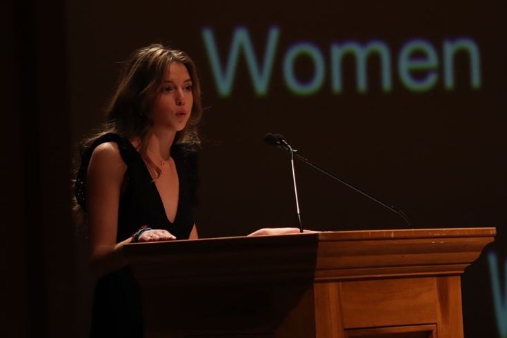 Woman speaking at a podium